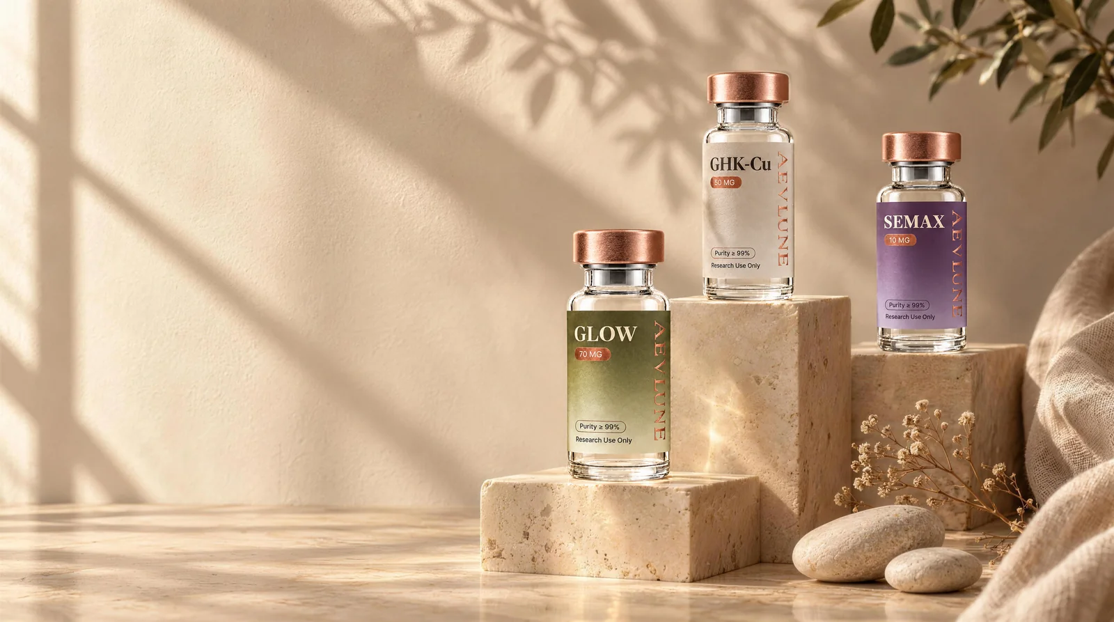 Three Aevlune vials, GLOW, GHK-Cu and SEMAX, on travertine blocks in late sunlight.
